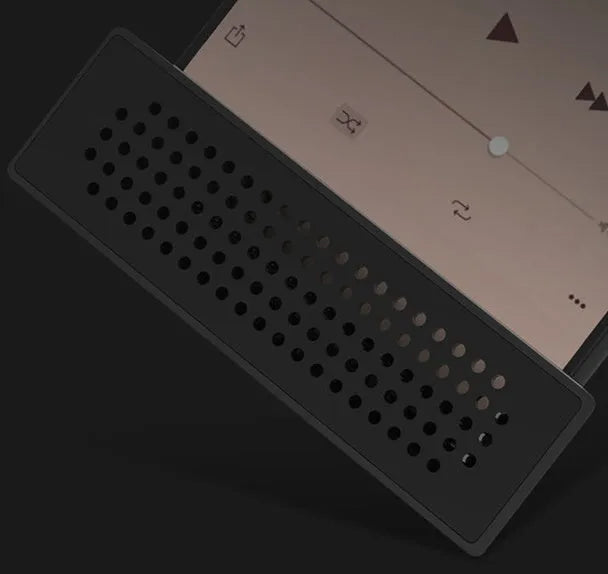 Mini black ABS plastic mobile phone amplifier bracket holding an iPhone on a desktop.