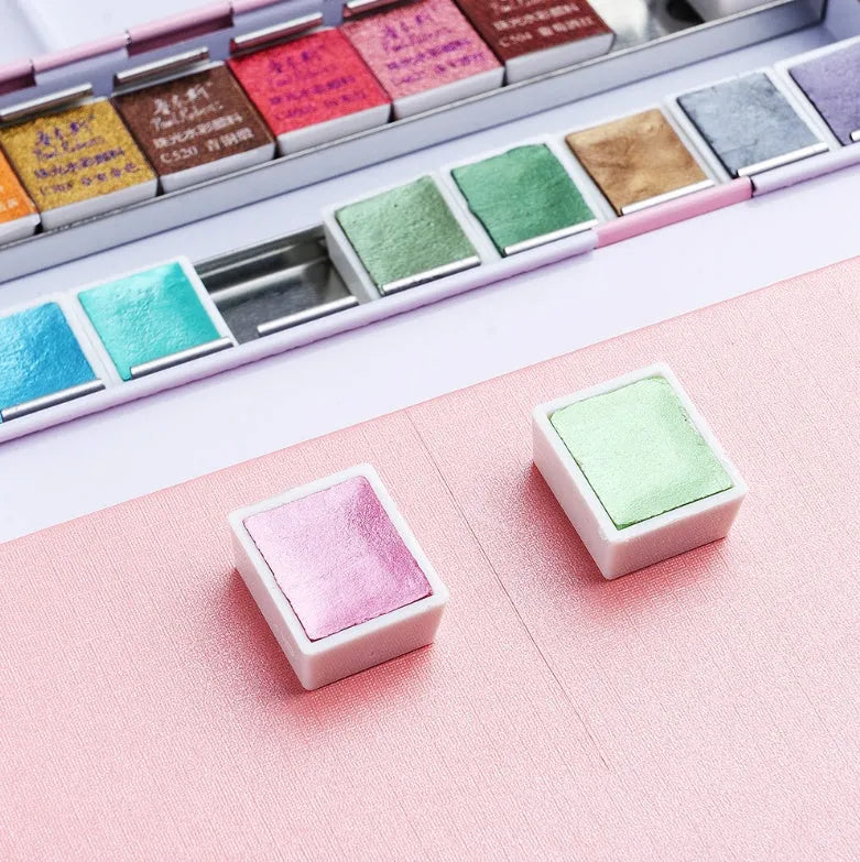 Set of solid watercolour paint blocks with pearl finish, showing 12 or 24 colour options.
