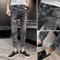 Men's high waist blue jeans with a five-pocket design and button fly on a mannequin.