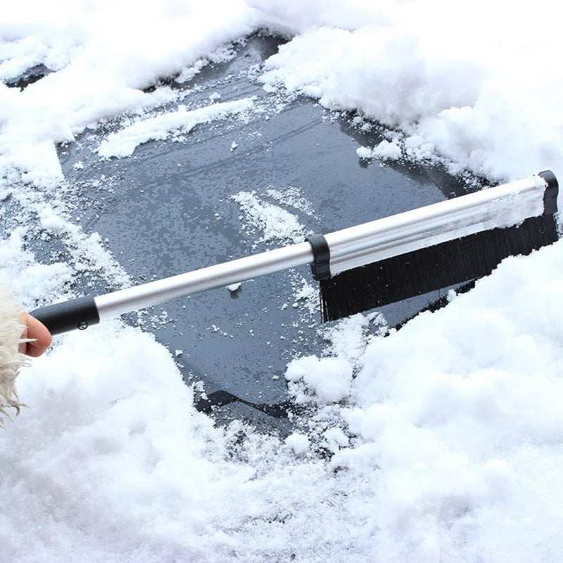 Silver telescopic snow brush and ice shovel on car windscreen, collapsed size 42.2cm, extended to 65cm