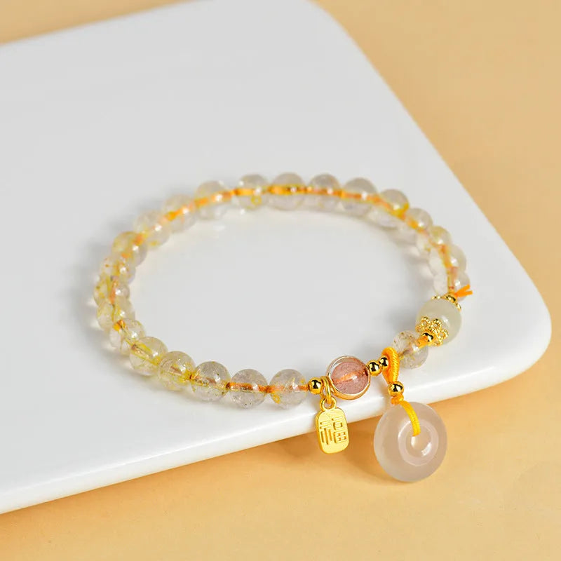 Gold rutilated quartz bracelet with safety buckle and geometric pendant in national style