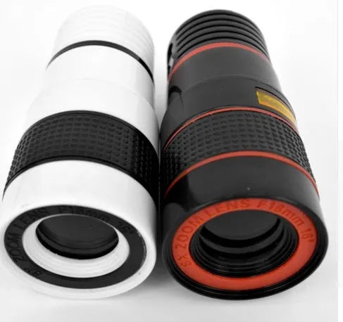 A black 12X phone telescope lens next to a universal mounting clip and cleaning cloth on a table.
