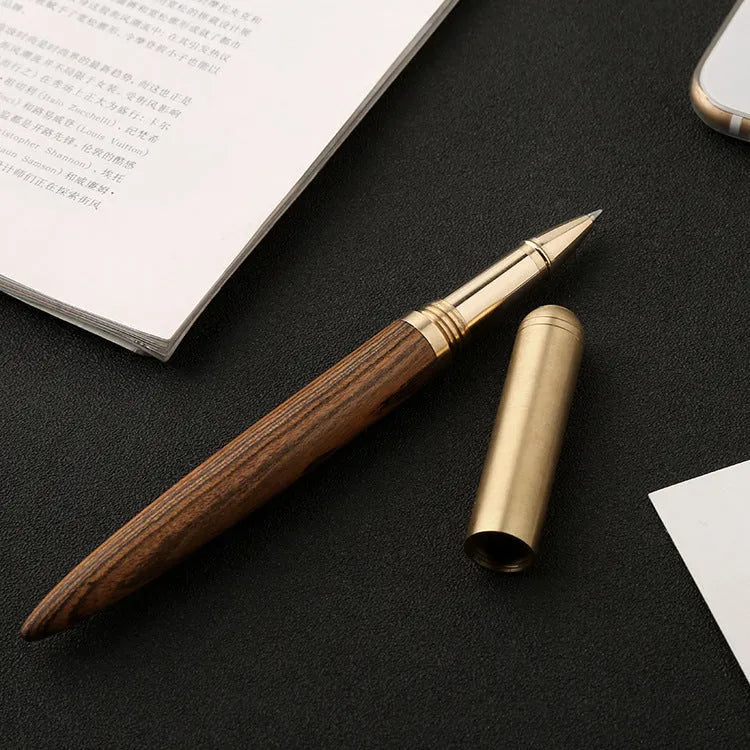 Brass and solid wood signature pen showing wood grain and metal details