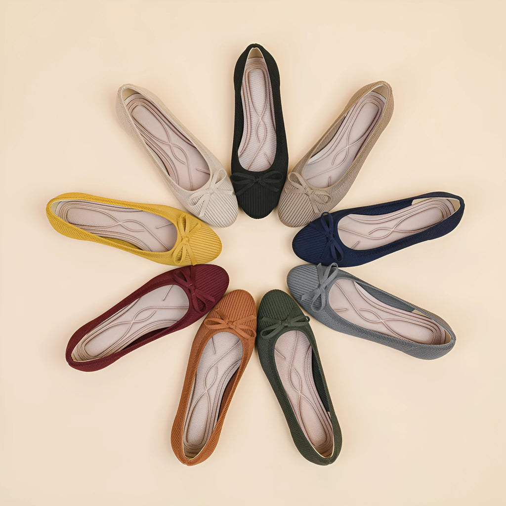 Women's butterfly print flat fabric pumps with round toe and flat heel on a white background.