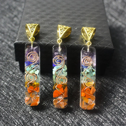 Chakra-inspired acrylic pendant with a unique geometric design and natural variations in the stone patterns