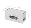 Grey and white plastic router storage box with cable ports for home cable management