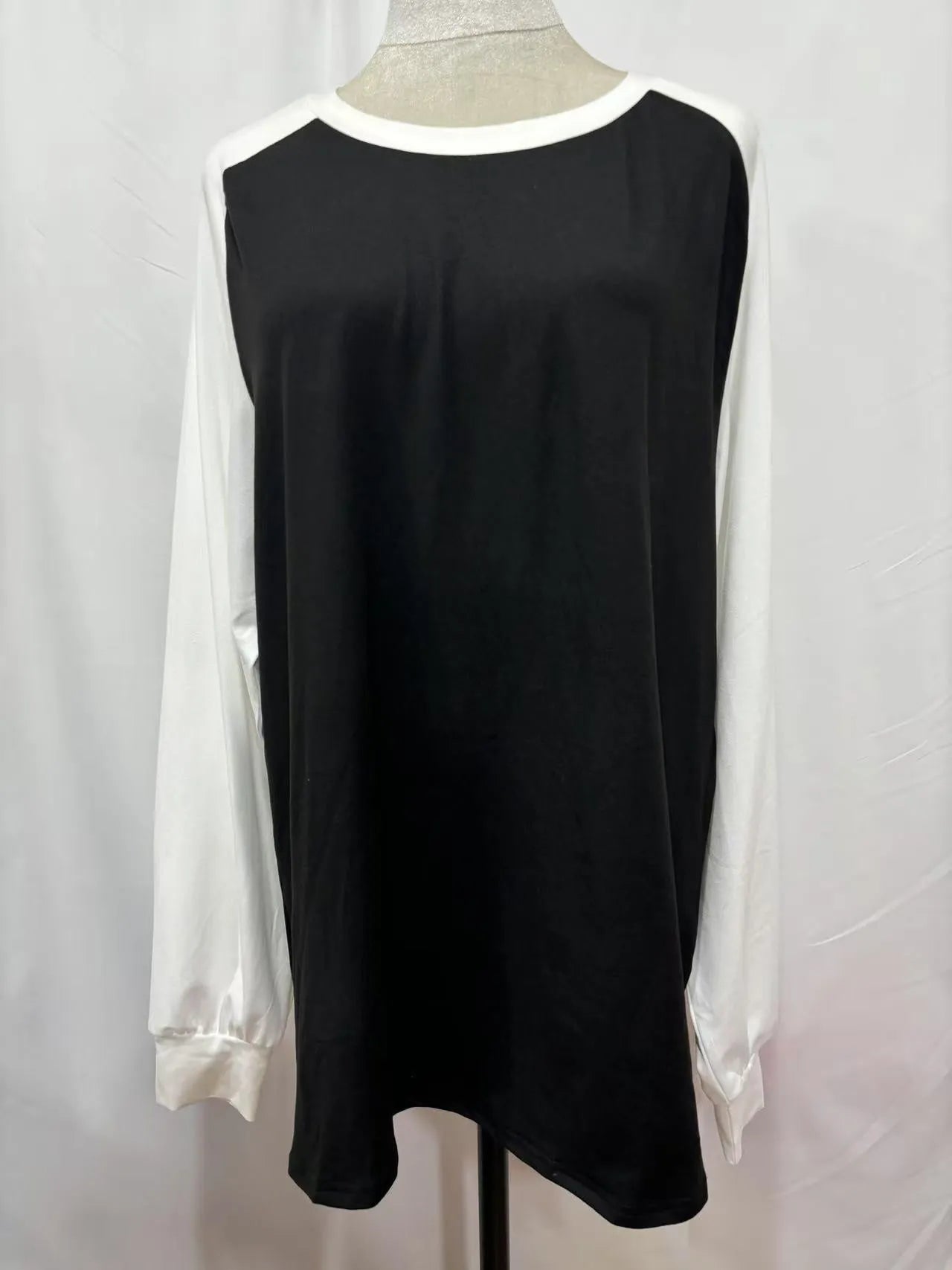 A casual long sleeve round neck T-shirt in a solid colour, shown flat to display its simple design.