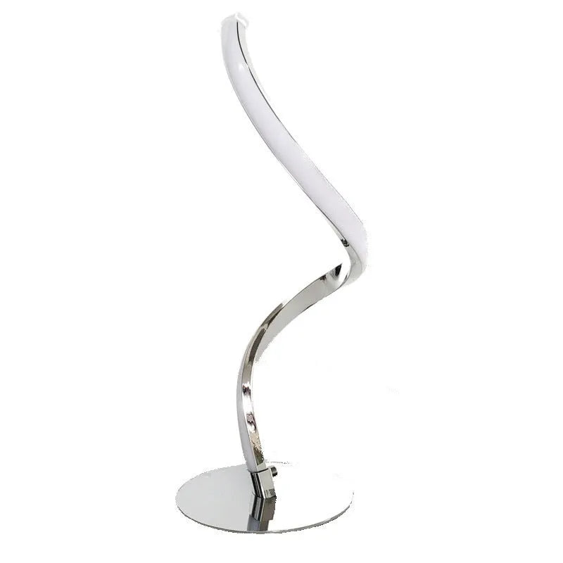 Advanced touch dimming desk lamp in white with white light mode on a bedside table