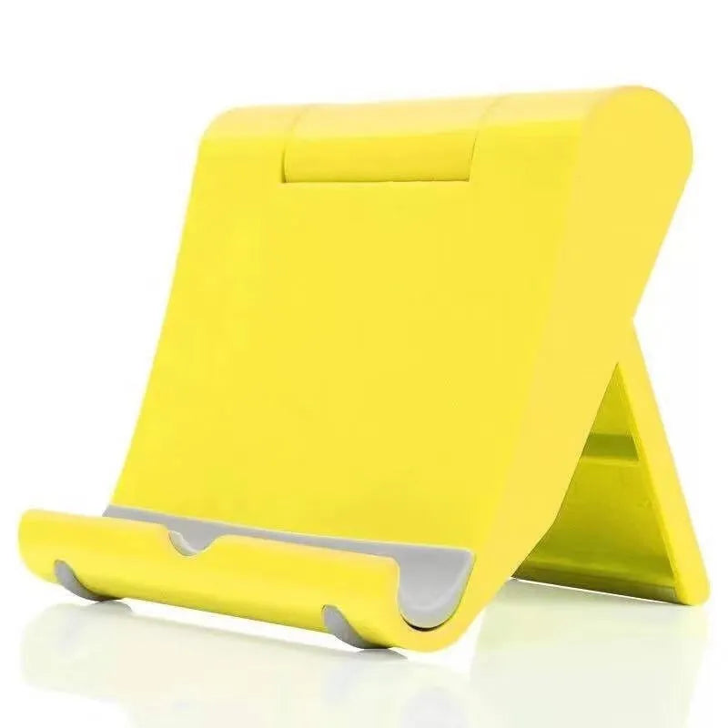 Folding phone and tablet stand in PP and TPR, about 10cm by 8cm by 2cm, in eight colours