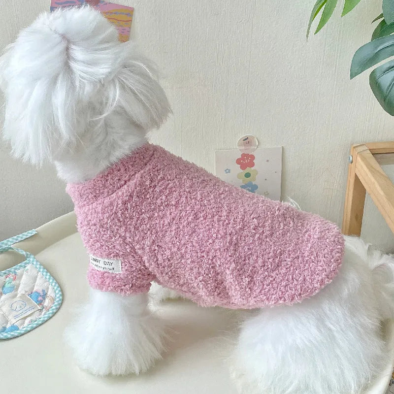 A small dog wearing a double-sided cloud velvet thickened jacket in one of six available colours.