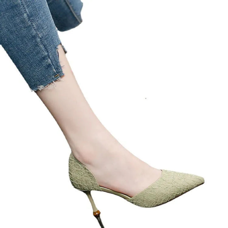 Women's black pointed toe stiletto high heels with a PU upper on a white background.