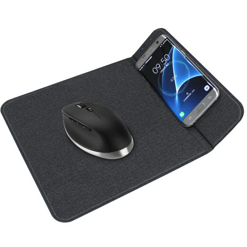 Black 2-in-1 wireless charging mouse pad on a desk with a phone resting on the built-in bracket