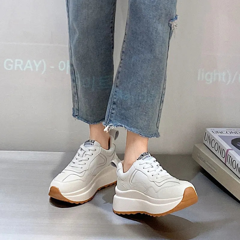 Women's beige cattlehide leather low-top casual sports shoes with cross strap and round toe.
