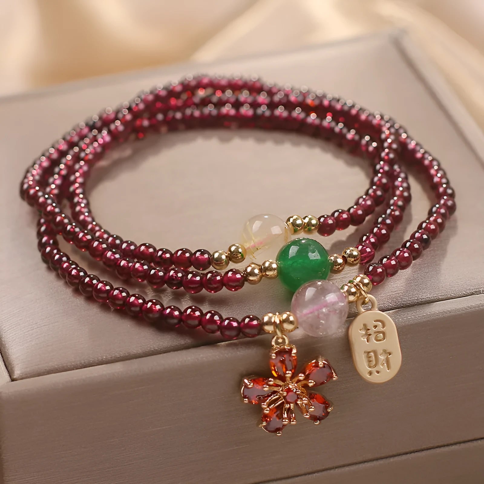 Crystal bracelet for women in pomegranate red cherry blossom colour with sequin details.