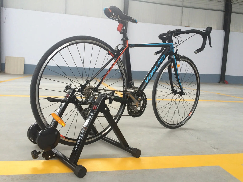 Black magnetoresistance indoor cycling training table with parking frame for 66-69CM wheel bikes