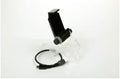 Black PS4 controller clip holding a mobile phone, with a micro USB OTG cable connected.