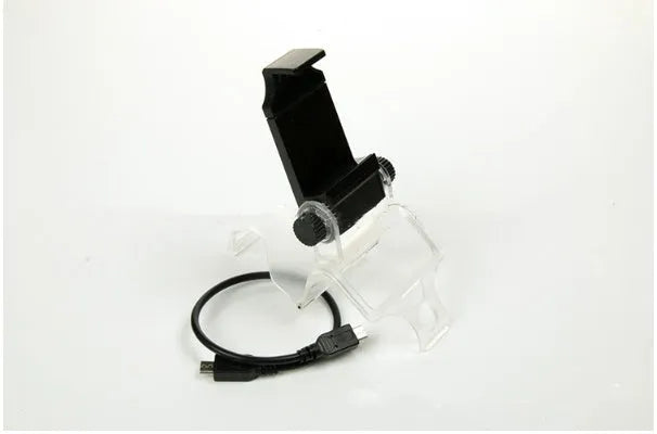 Black PS4 controller clip holding a mobile phone, with a micro USB OTG cable connected.