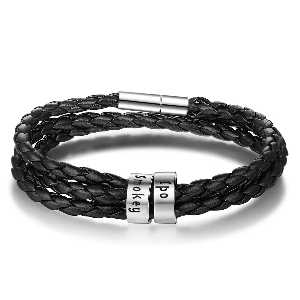 Personalized leather bracelet with engraved name charm for men, featuring a braided design and stainless steel beads