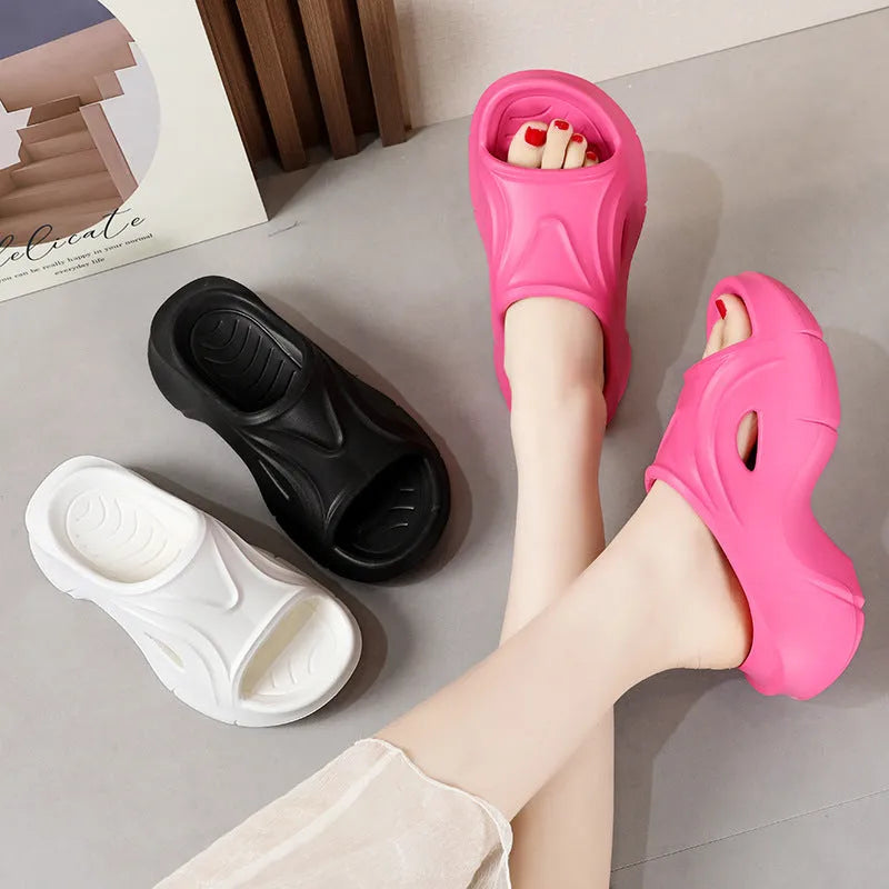 Women's thick-soled EVA beach slippers in white, black, and rose red colours with round toe design