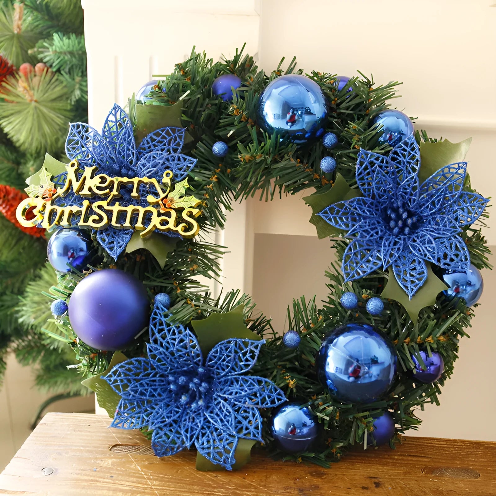 30cm circular plastic Christmas wreath with festive foliage in a choice of seven colours.