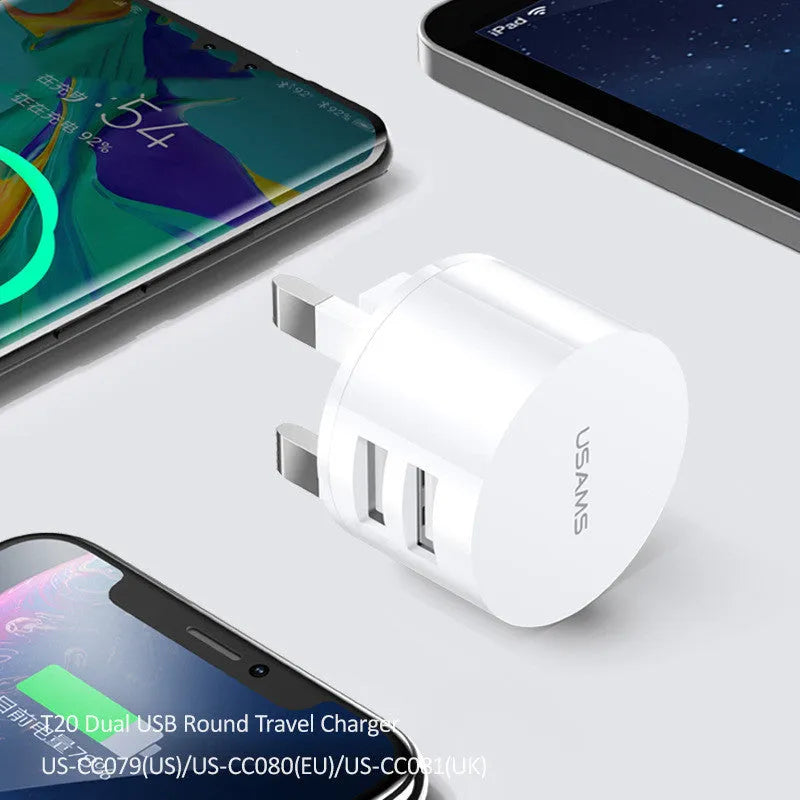 White portable universal dual USB charger with EU, UK and US adaptor heads for international travel