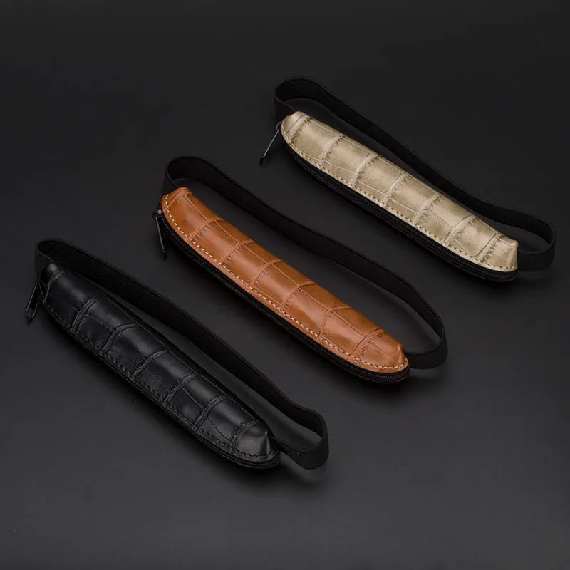 Long slim PU leather pencil case in beige grey, black, black crocodile pattern, and brown crocodile pattern.