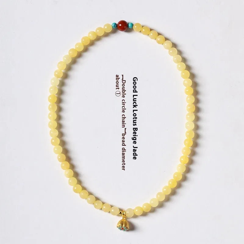 Yellow jade coloured topaz bracelet with double ring design and lotus seedpod beads
