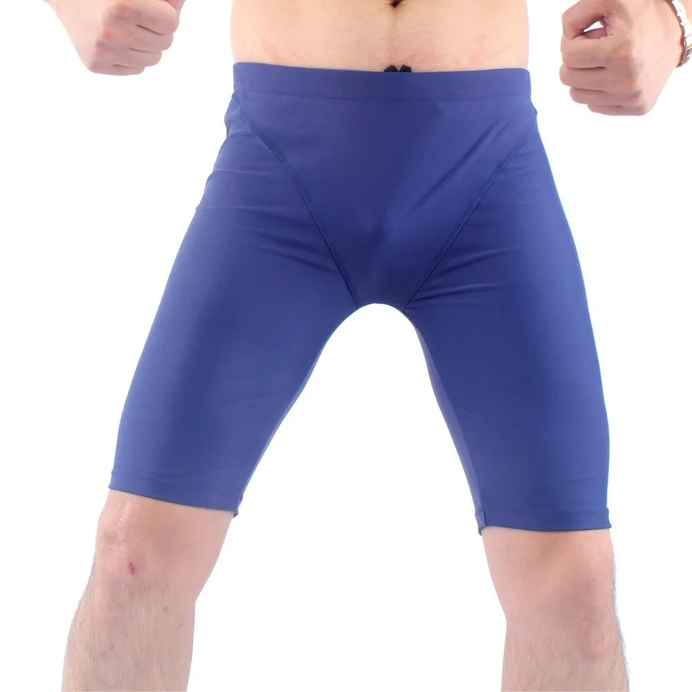Men's green and navy blue swimming trunks with quick-dry fabric and anti-embarrassment lining
