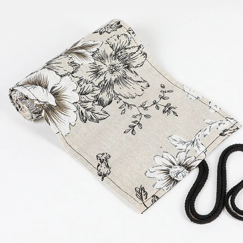 Black Peony floral print canvas pencil roll bag unrolled showing 24 or 72 holes for pencils.