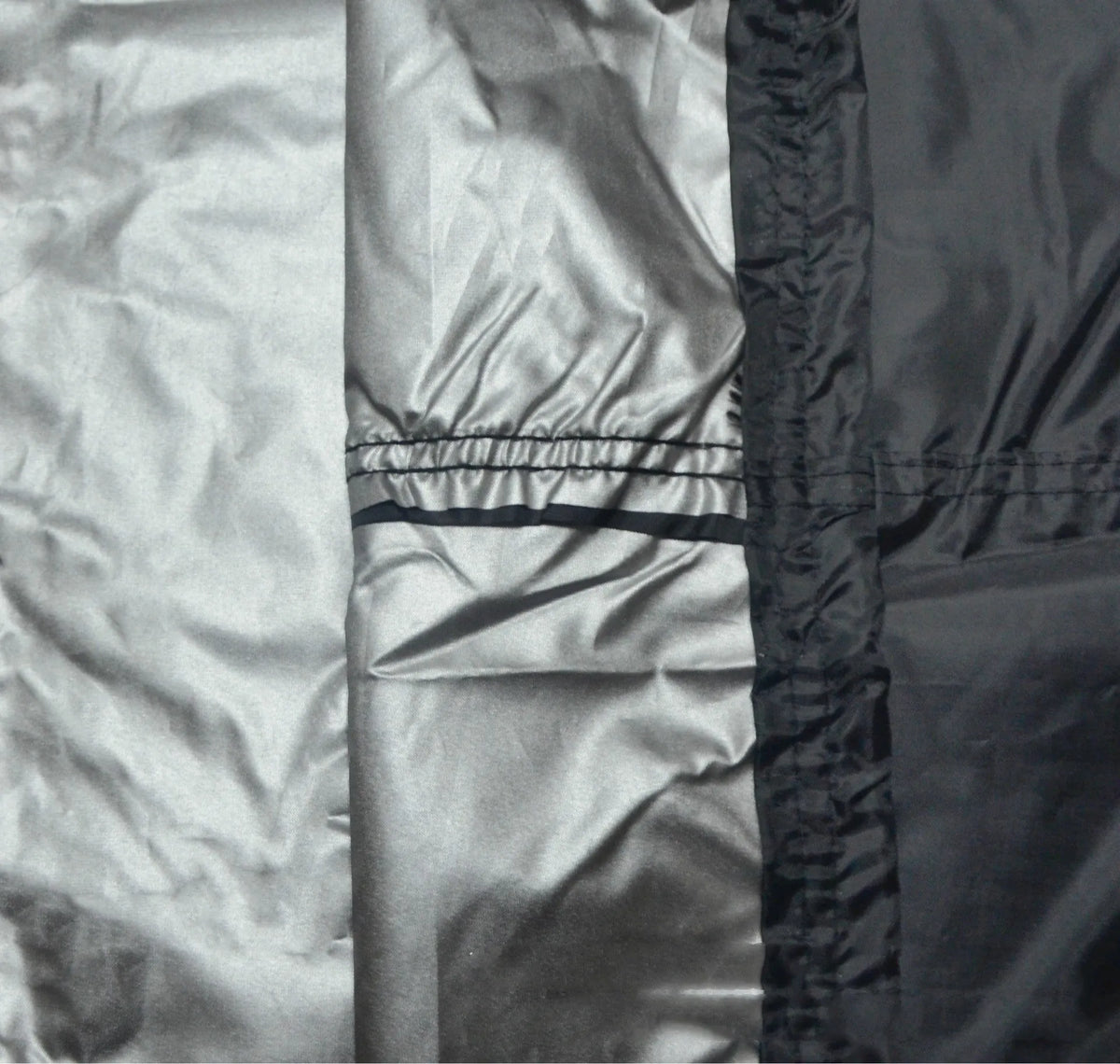Black outdoor grill cover with silver inner coating, 58x77cm, for barbecue protection