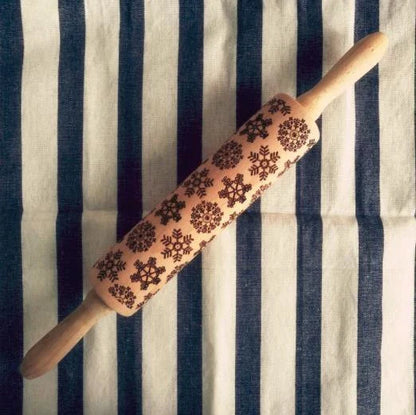 Personalized Christmas rolling pin with a variety of embossed holiday designs, including snowflakes, reindeer, and Merry Christmas patterns