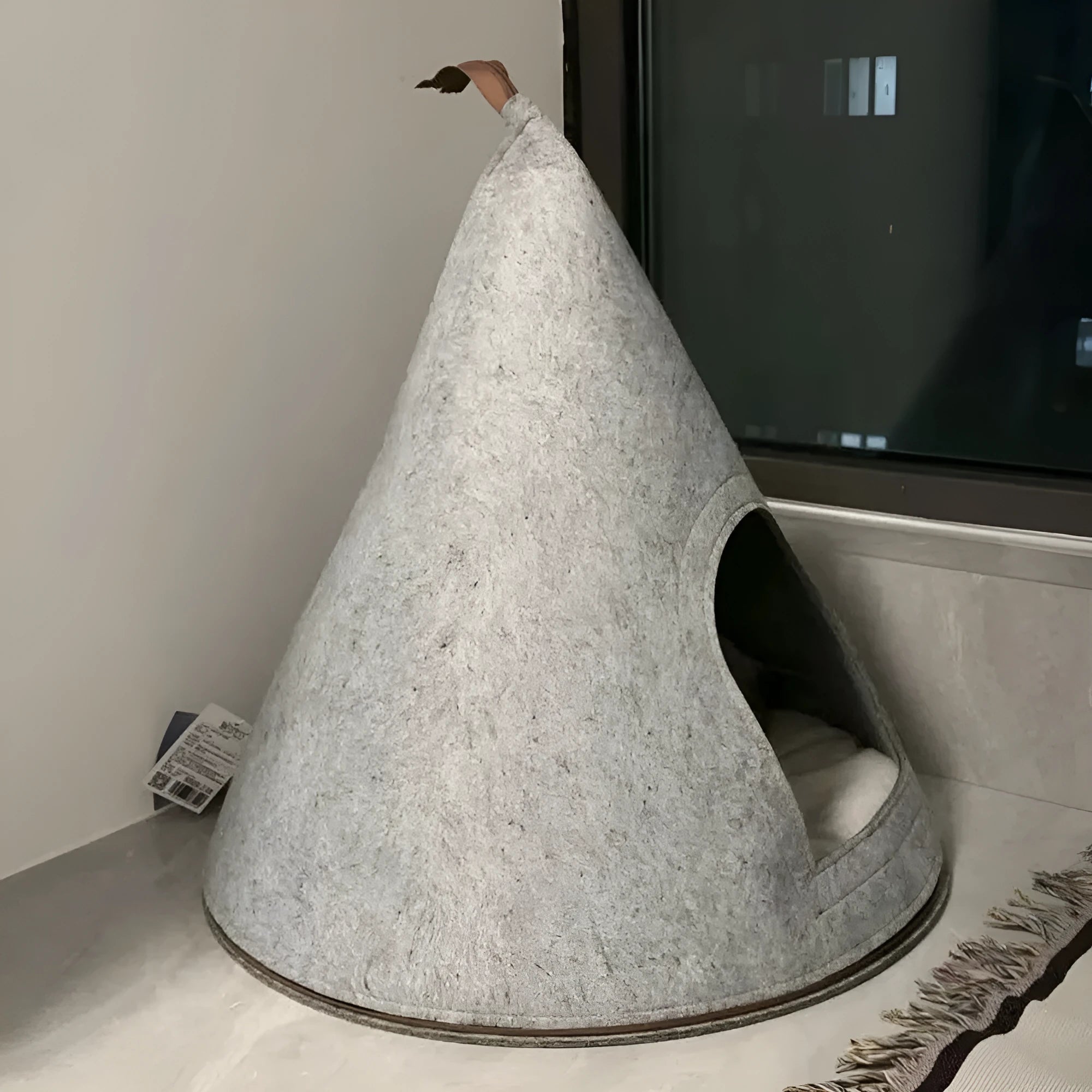 Grey cone-shaped felt cat house with enclosed tent design for indoor cats