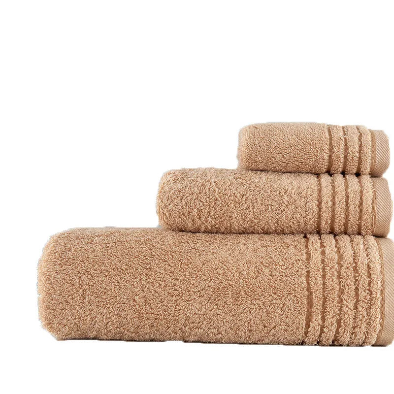 Cotton towel set in beige and brown showing face, hand, and bath towel sizes