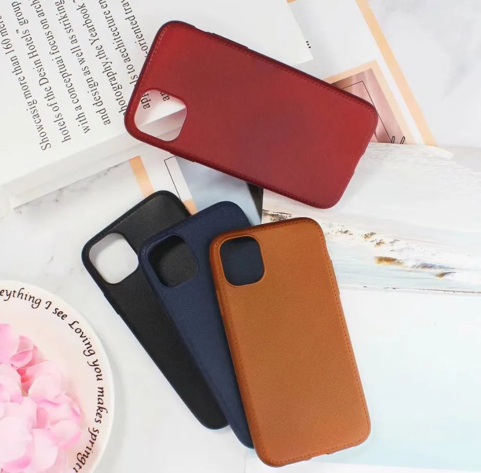 Leather and TPU iPhone case in black, shown on an iPhone.