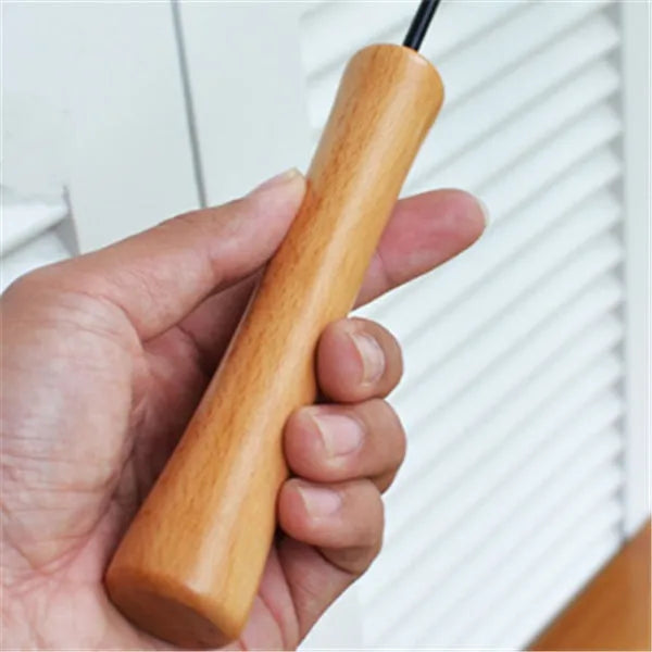 Funny cat stick with wooden handle, flexible rod, and black and white fur replacement head with feather and bell