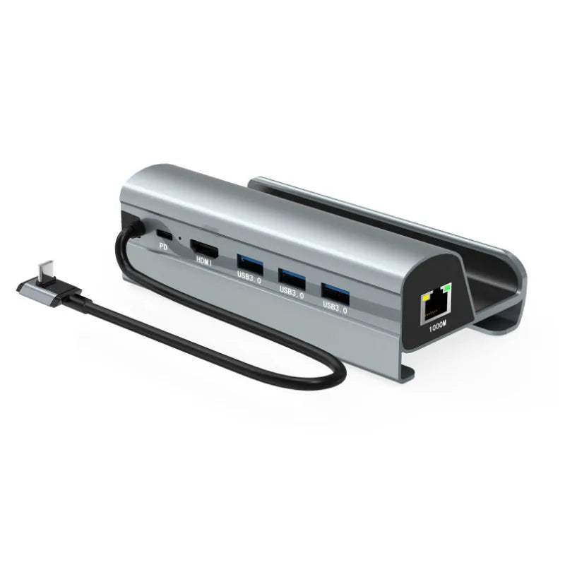 GPD WIN4 handheld gaming console base expander dock in black or silver grey with extra USB, HDMI, and Ethernet ports.
