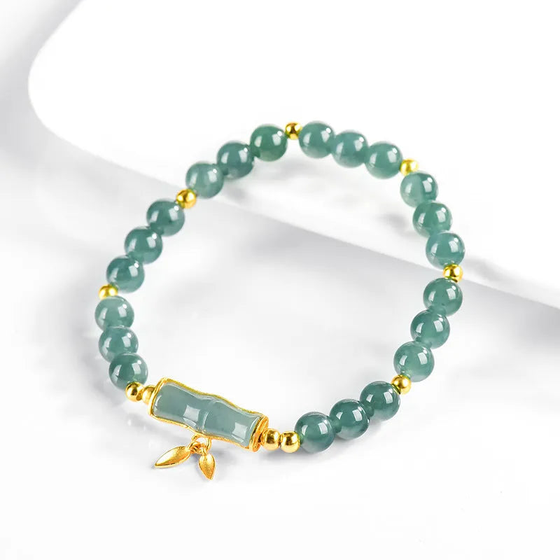 Women's high-rise bracelet with blue water round jade beads on S925 silver.