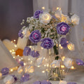 LED rose fairy light string with battery pack for indoor holiday decoration.