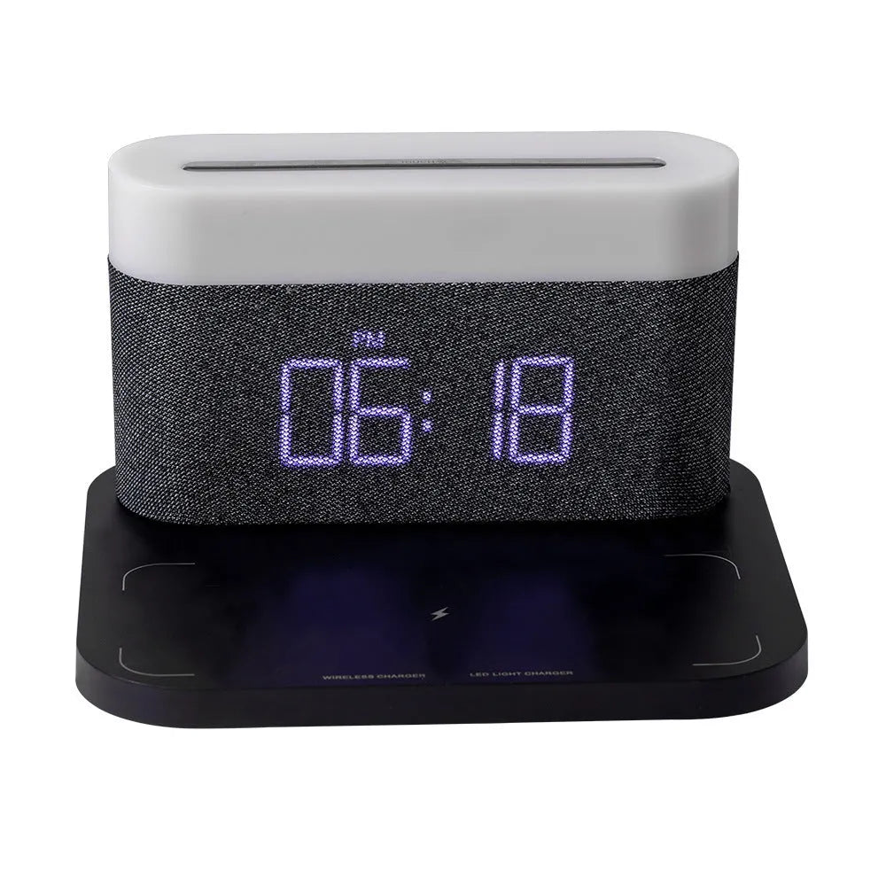 Black and white multifunctional table lamp with integrated digital clock and wireless phone charging pad
