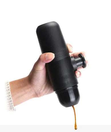 Black portable manual espresso coffee machine with stainless steel parts, shown at 17.5cm height.
