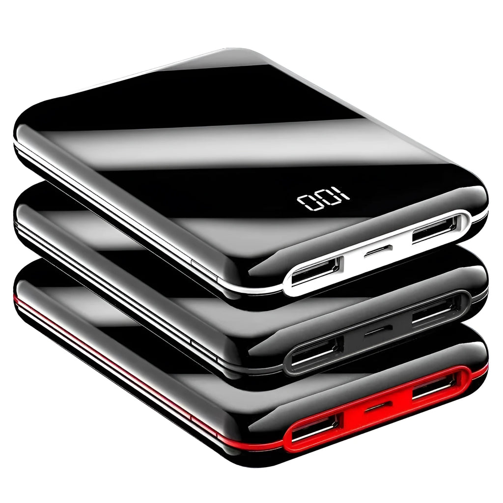 Black mini power bank with digital LCD screen showing battery percentage, next to a smartphone.