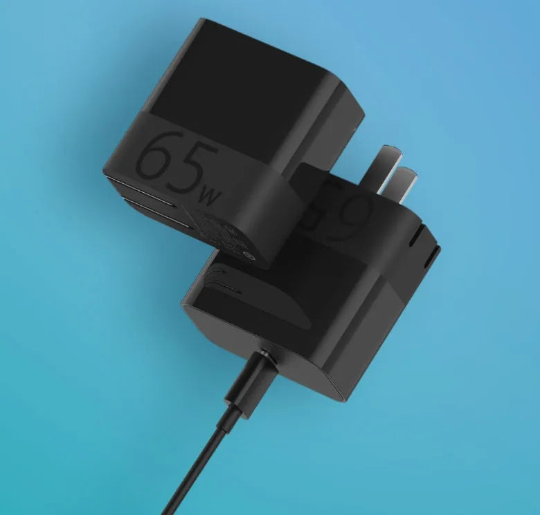 Black ZMI 65W USB-C notebook power adapter with compact design.