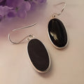 Women's black oval agate pendant earrings with 925 silver detail and geometric Chinese design