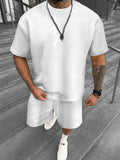 Men's short sleeve top and shorts suit with printed pattern for sports leisure wear.