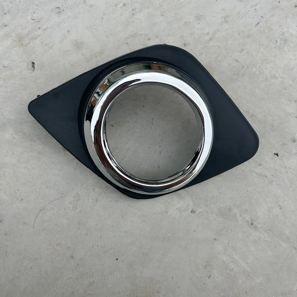 Black anti-fog lamp cover accessory for Toyota RAV4 front bumper, suitable for driver or passenger side.