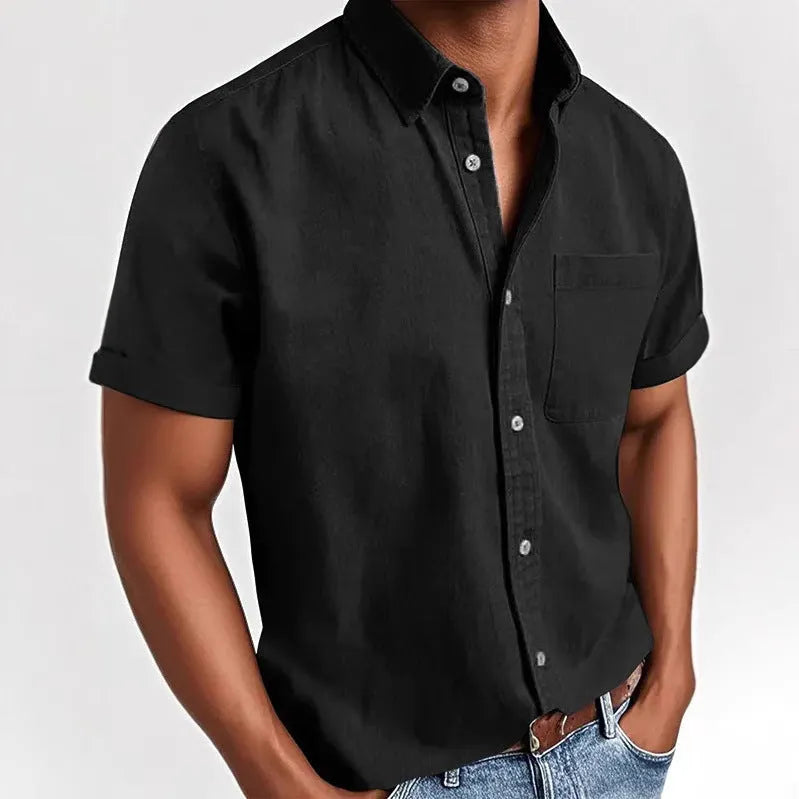 Men's solid colour short sleeve polo shirt with a chest pocket and polo collar on a hanger.