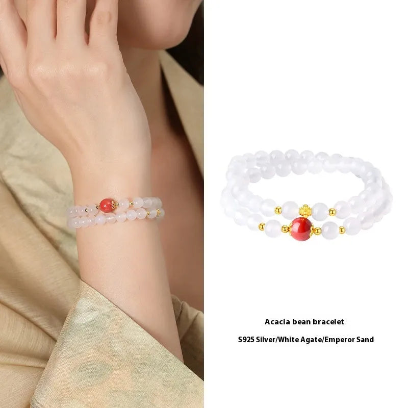 White agate women's bracelet with 6mm beads, geometric double-layer design and a jequirity bean cinnabar accent.