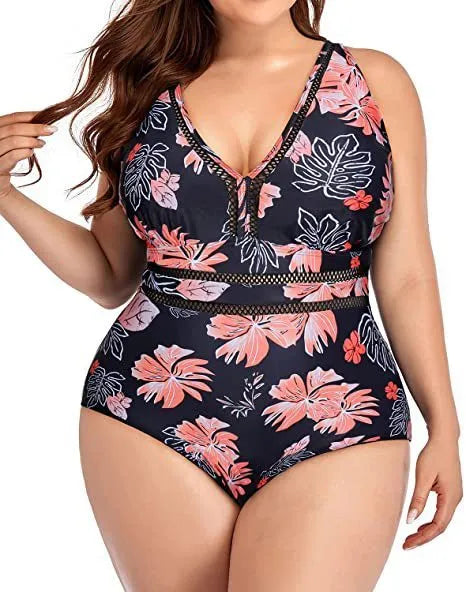 Black printed plus size women's bikini swimsuit with mesh stitching, shown on a model.