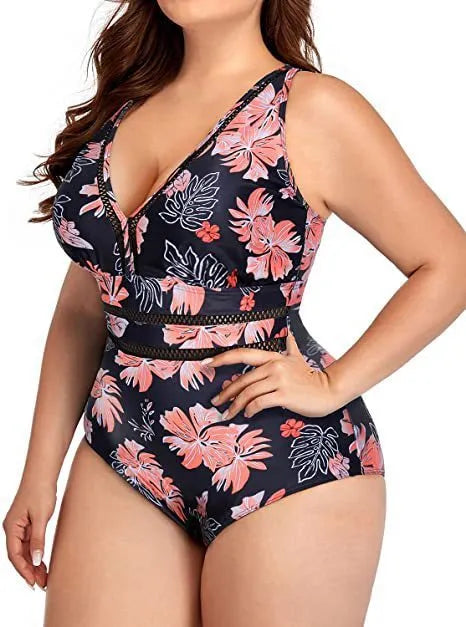 Black printed plus size women's bikini swimsuit with mesh stitching, shown on a model.