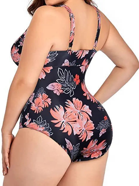 Black printed plus size women's bikini swimsuit with mesh stitching, shown on a model.